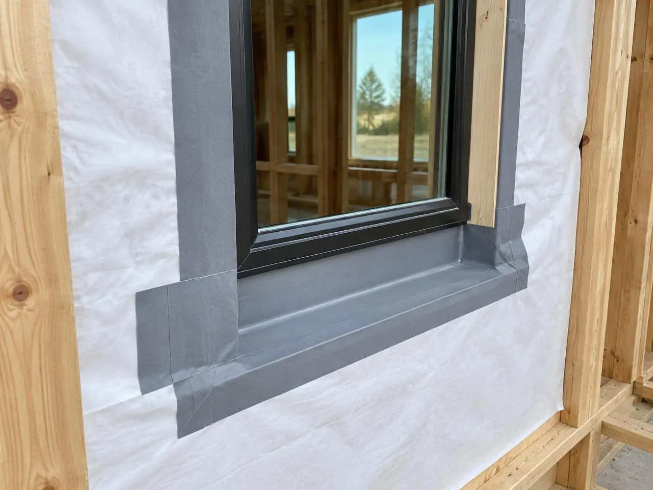 Close-up of framing and wall assembly during construction